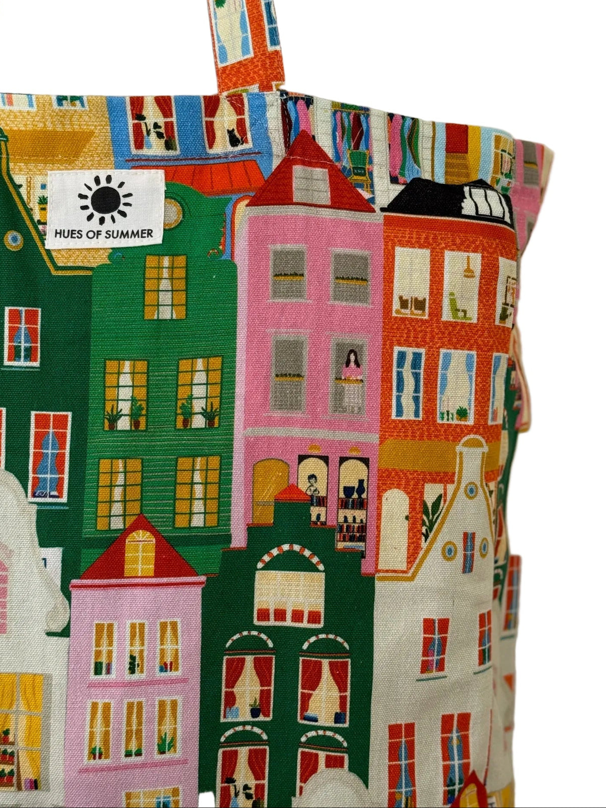 Close-up of the Amsterdam Canal tote bag fabric showing colorful canal house illustrations