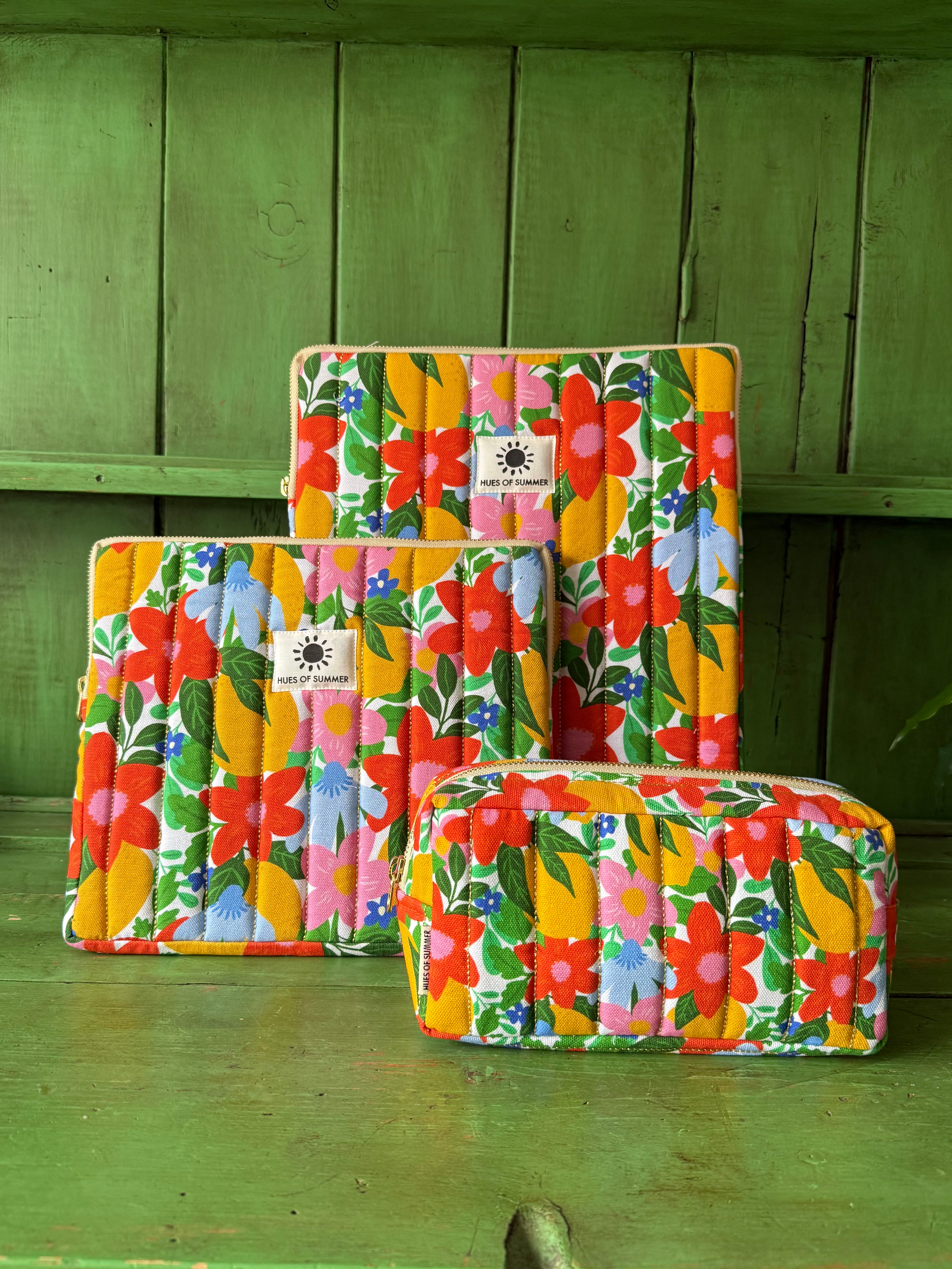 Citrus Blooms tablet sleeve, laptop sleeve, and cosmetic pouch grouped together