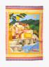 A colorful tea towel featuring a vibrant illustration of a coastal town with lemon trees and a blue sky.