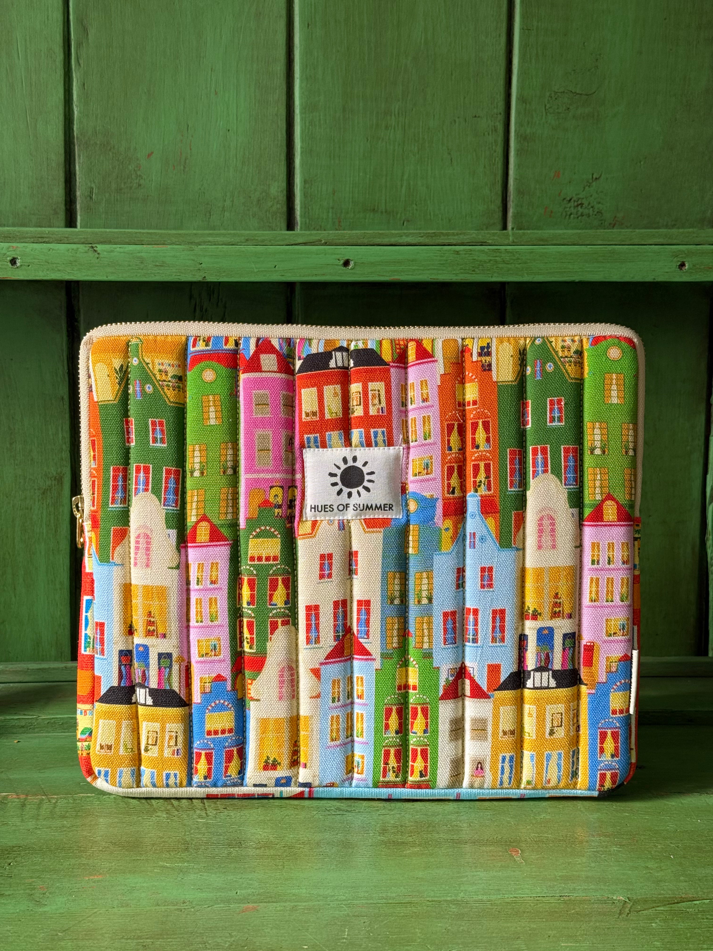 Amsterdam quilted tablet sleeve with canal house print, front view standing upright