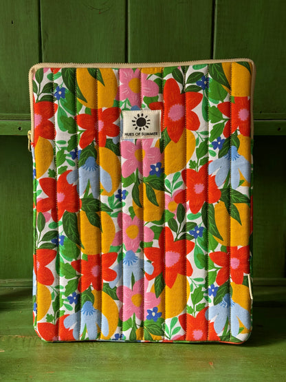 Citrus Bloom quilted laptop sleeve with floral print, front view standing upright