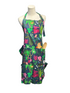 A colorful garden-themed apron with a dark navy background and a vibrant floral print, displayed on a mannequin torso. The apron features pockets containing gardening tools and is set against a blue paneled wall.