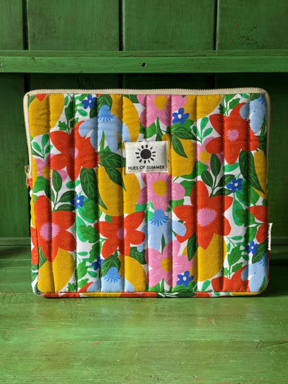 Citrus Blooms quilted tablet sleeve, front view showing floral gold-quilted design